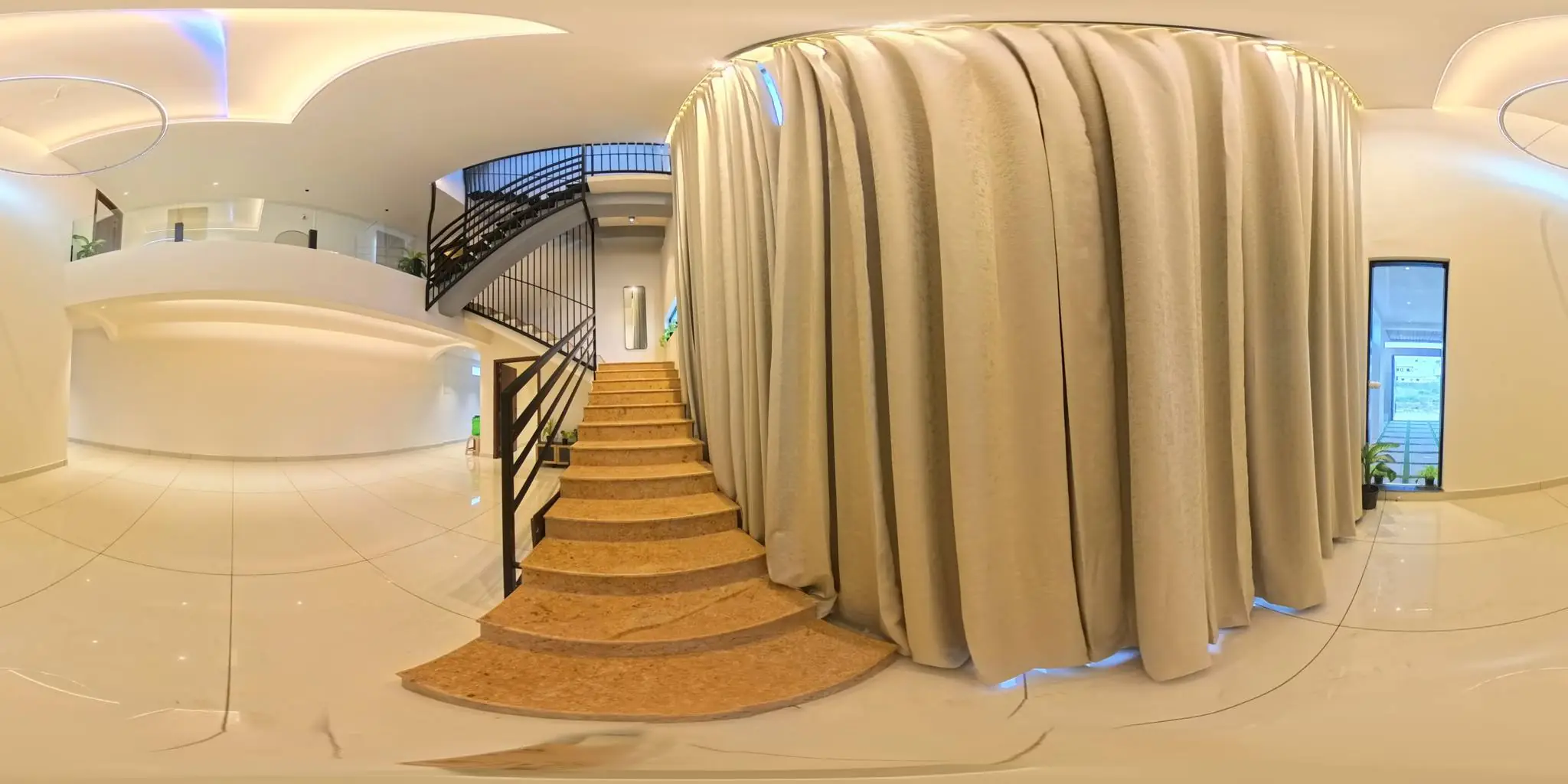 360 degree foyer with a grand staircase