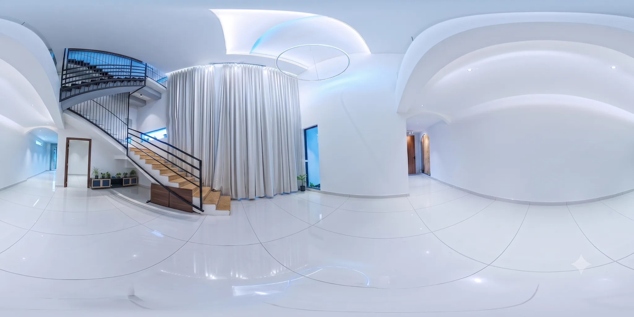 360 degree view of the double-height foyer and curved staircase